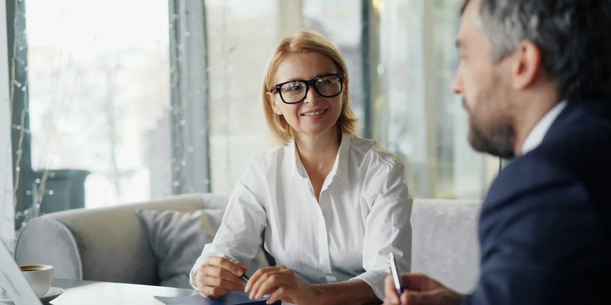 A financial advisor meeting with a client over documents
